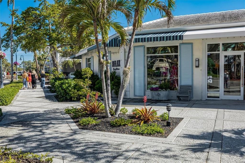 780 10th Avenue South, Unit 24 Naples, FL 34102 - Photo 15 of 15 a front view of a house with garden
