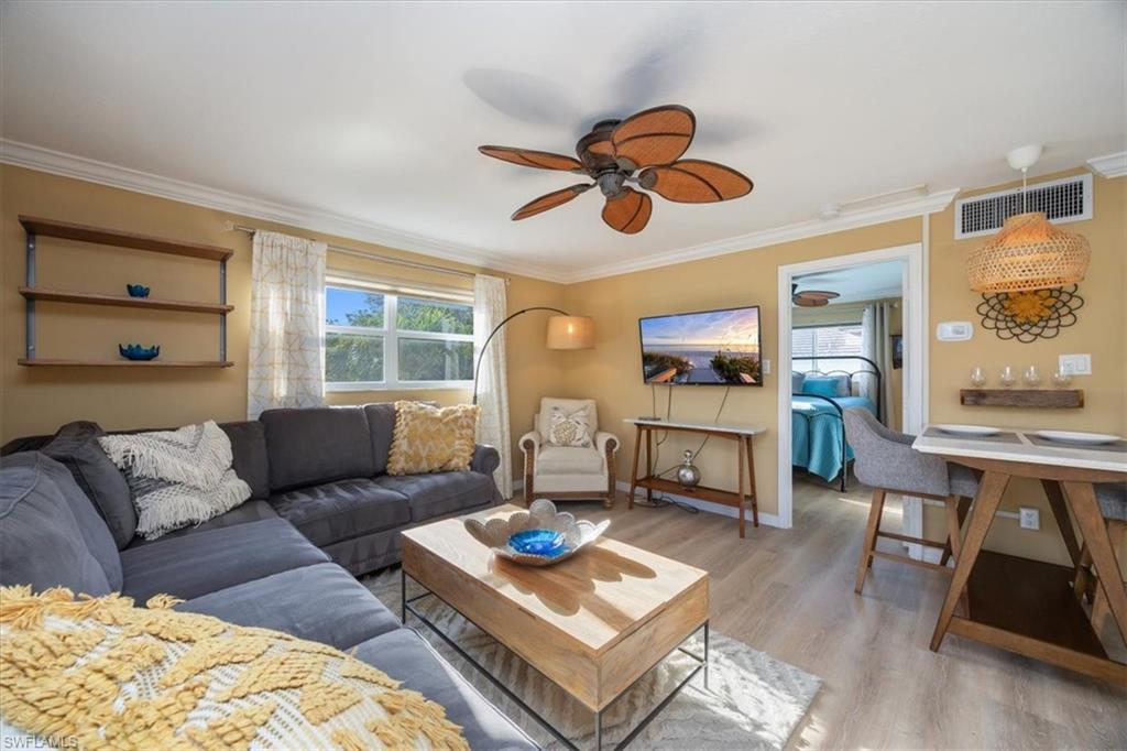 780 10th Avenue South, Unit 24 Naples, FL 34102 - Photo 4 of 15 a living room with furniture and a large window