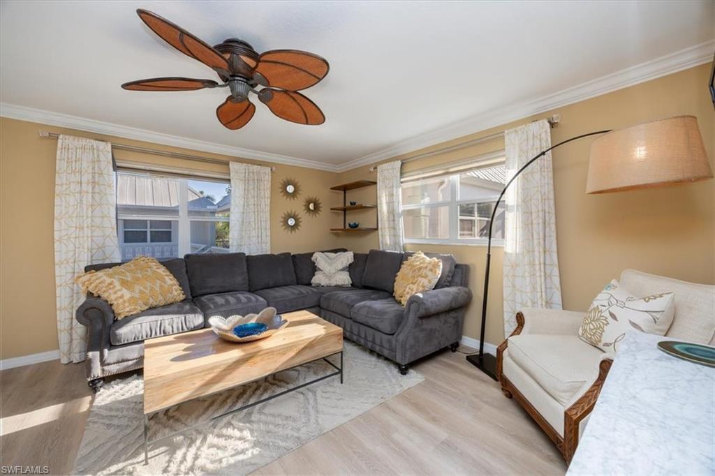780 10th Avenue South, Unit 24 Naples, FL 34102 - Photo 5 of 15 a living room with furniture and a large window