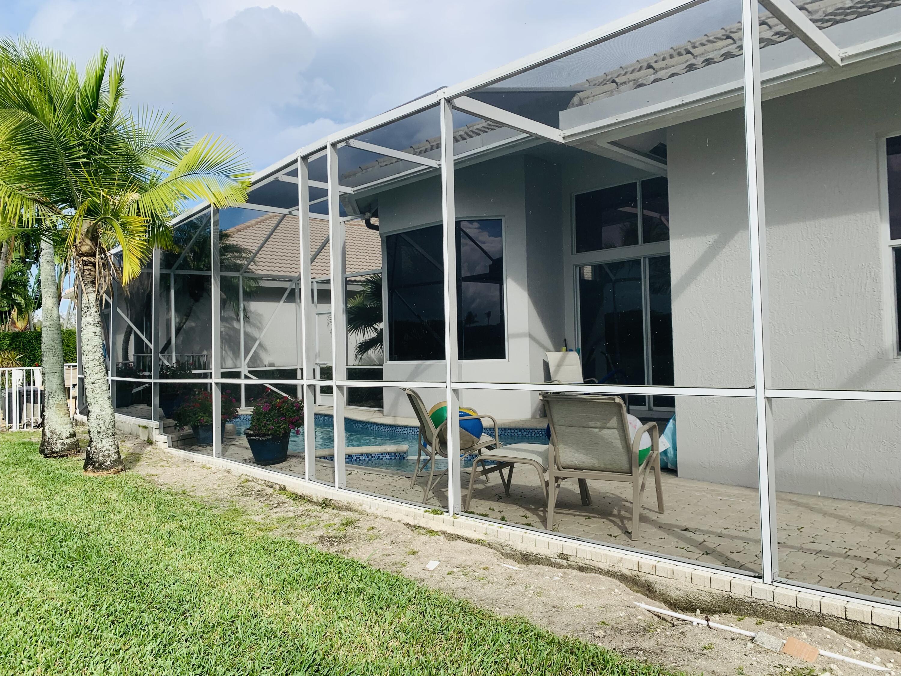 4167 Northwest 53rd Street Boca Raton, FL 33496 - Photo 29 of 48 Screened Pool area - rear perspective