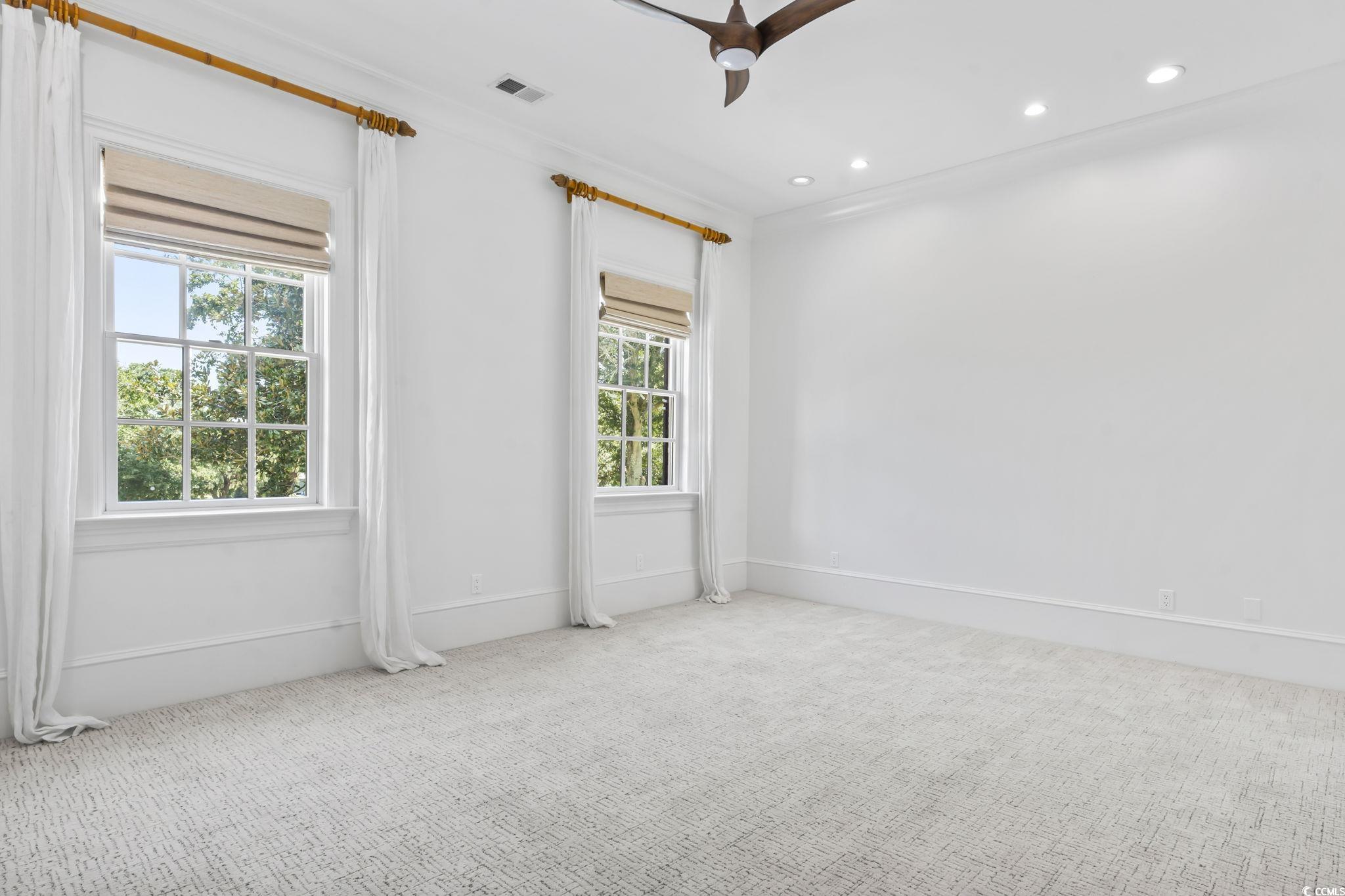 9318 Cove Drive Myrtle Beach, SC 29572 - Photo 23 of 40 Carpeted spare room with recessed lighting, crown molding, and a ceiling fan