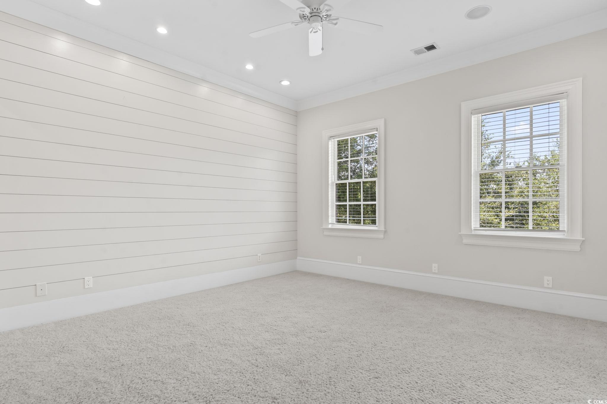 9318 Cove Drive Myrtle Beach, SC 29572 - Photo 25 of 40 Spare room with carpet flooring, recessed lighting, crown molding, and ceiling fan