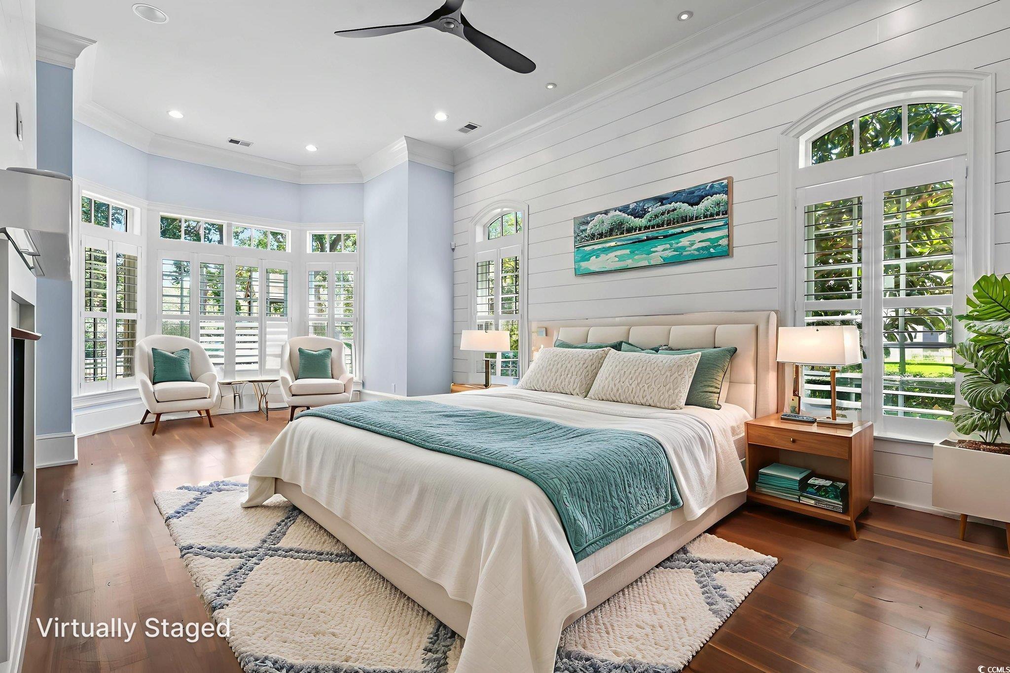 9318 Cove Drive Myrtle Beach, SC 29572 - Photo 9 of 40 Bedroom with crown molding, dark wood-type flooring, ceiling fan, recessed lighting, and wooden walls