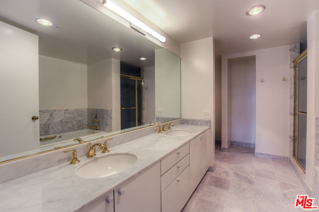 10520 Wilshire Boulevard, Unit 905 Los Angeles, CA 90024 - Photo 15 of 17 a bathroom with a double vanity sink mirror and double