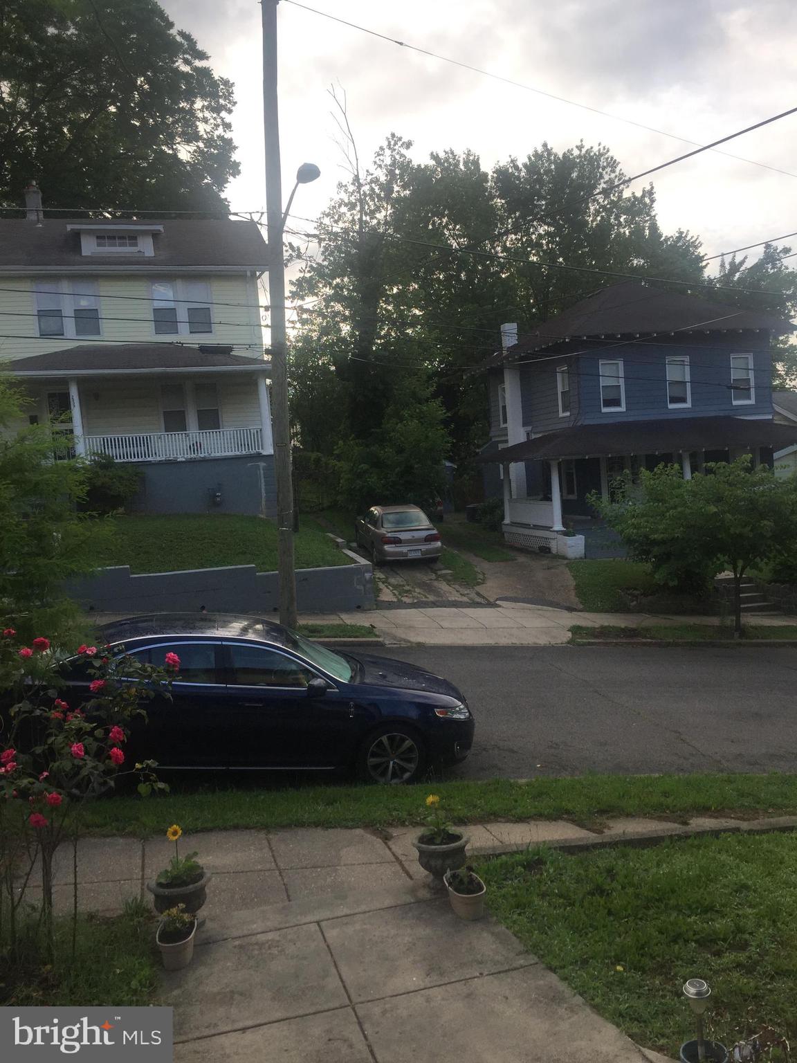 2906 25th Street Northeast Washington, DC 20018 - Photo 16 of 40 a front view of a house with a garden