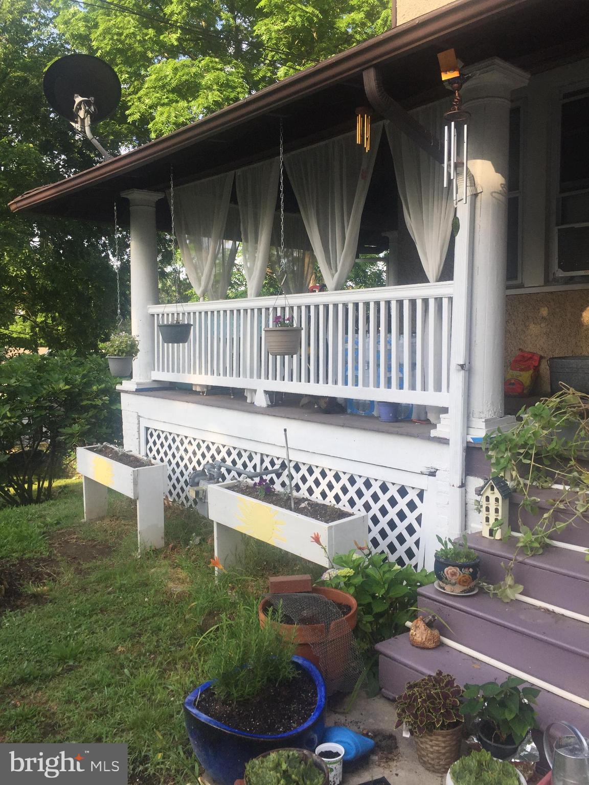 2906 25th Street Northeast Washington, DC 20018 - Photo 17 of 40 a front view of a house with a garden
