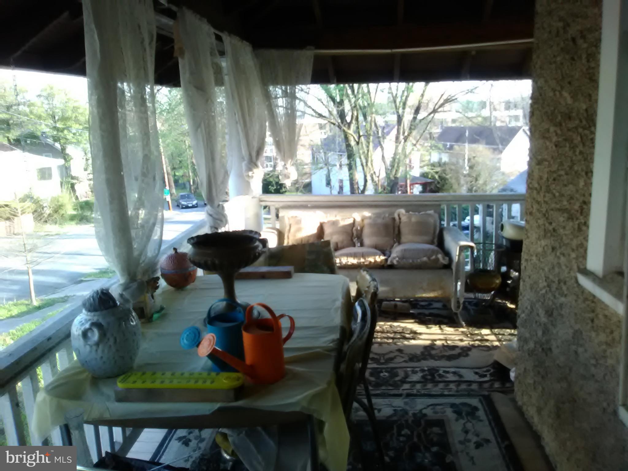 2906 25th Street Northeast Washington, DC 20018 - Photo 35 of 40 a living room filled with furniture and a floor to ceiling window