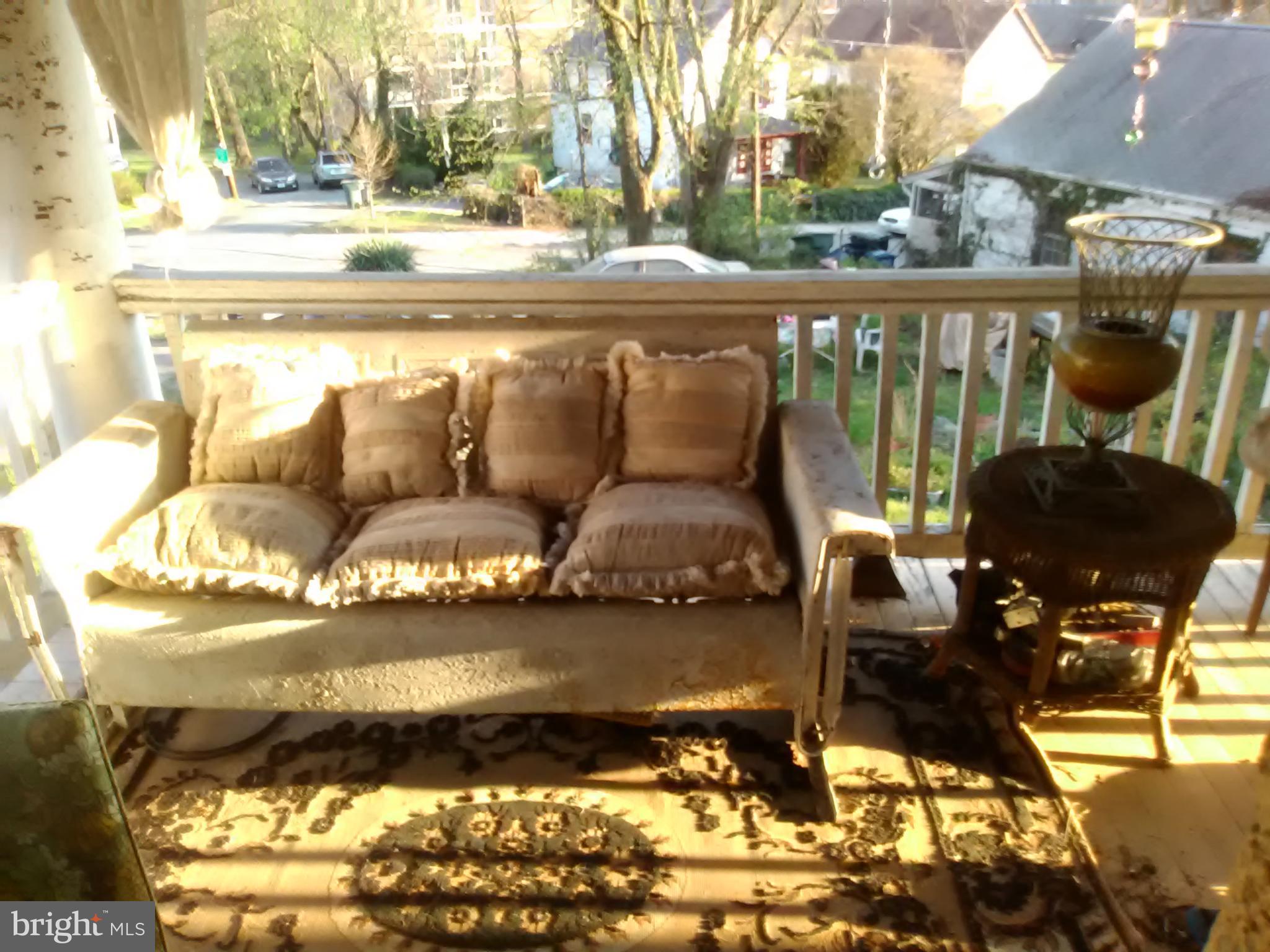 2906 25th Street Northeast Washington, DC 20018 - Photo 36 of 40 a living room with furniture and a floor to ceiling window