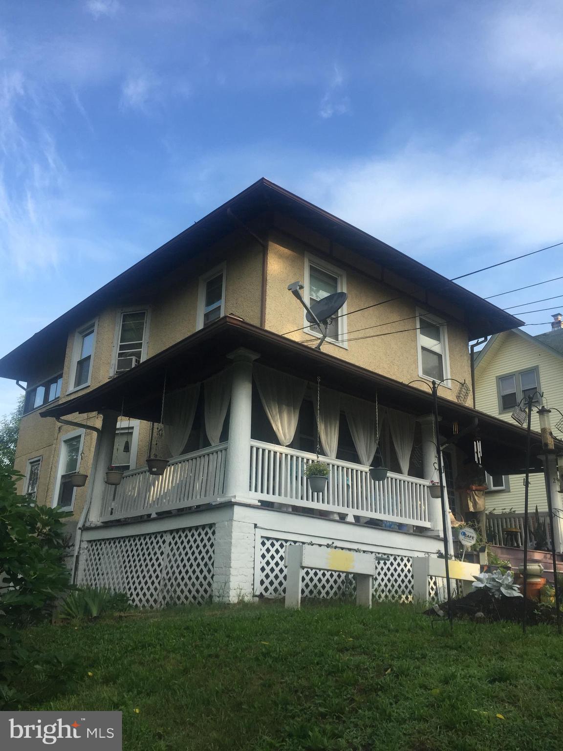 2906 25th Street Northeast Washington, DC 20018 - Photo 8 of 40 a front view of a house with a yard