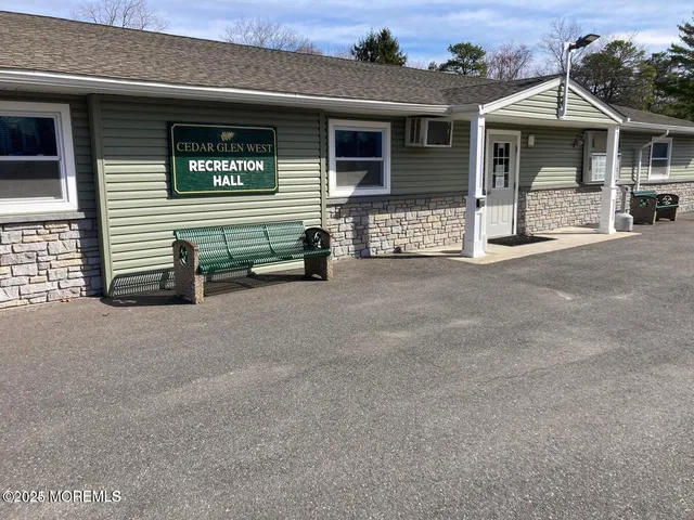 a view of a house with many windows and a table