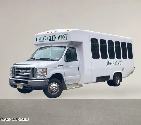 a view of a studio with lots of furniture