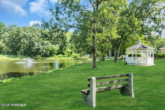 a view of a backyard with swimming pool