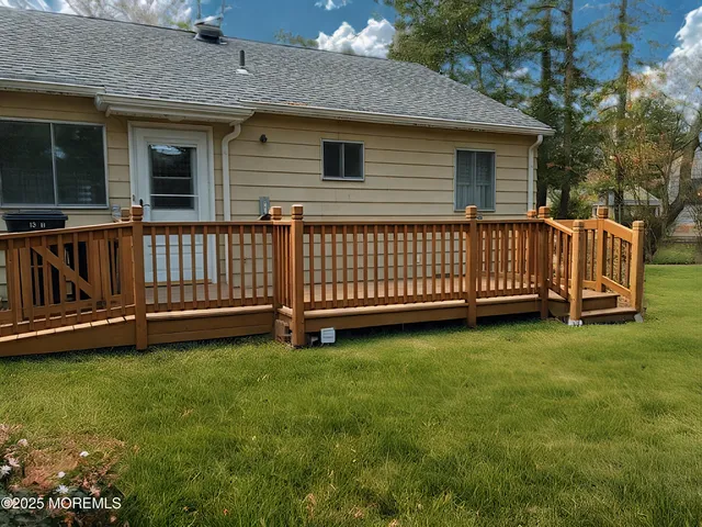 a view of backyard with deck