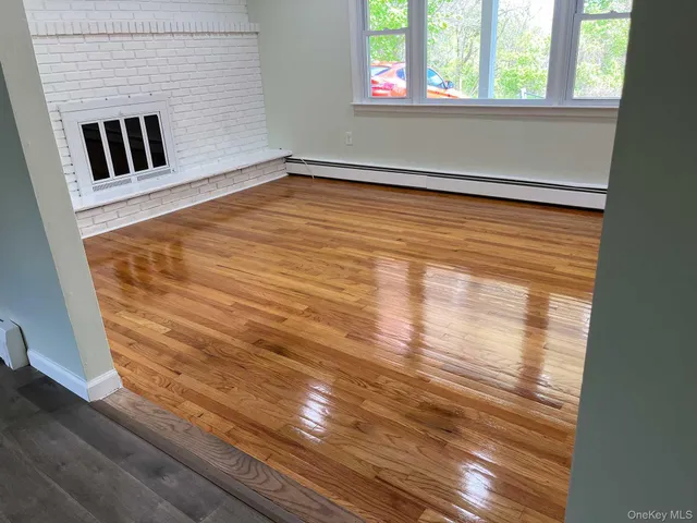 a view of empty room with stair and window