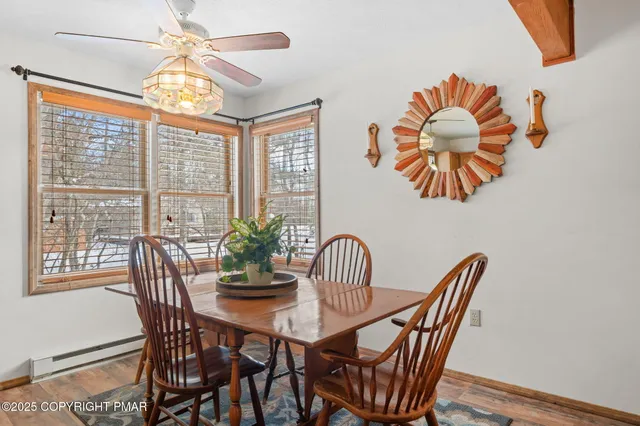 a view of a dining room with furniture window and outside view
