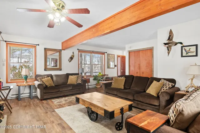 a living room with furniture and a large window