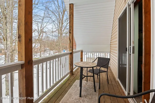 a view of a balcony with chairs