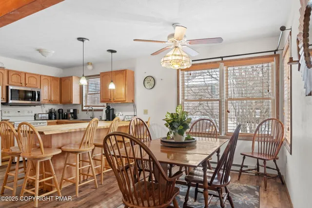 a view of a dining room with furniture window and outside view