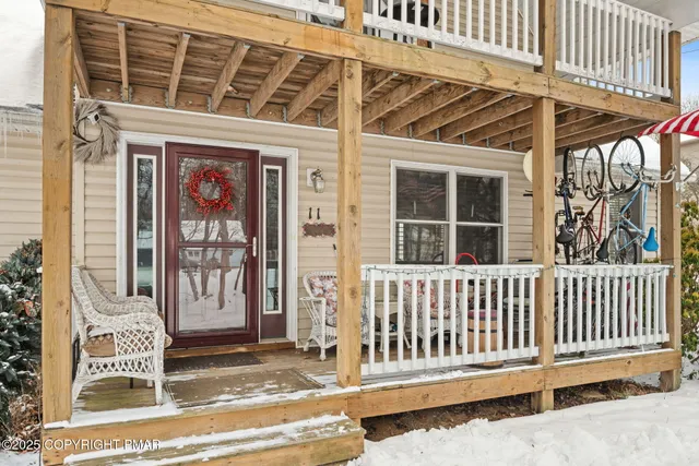a view of porch with a bench