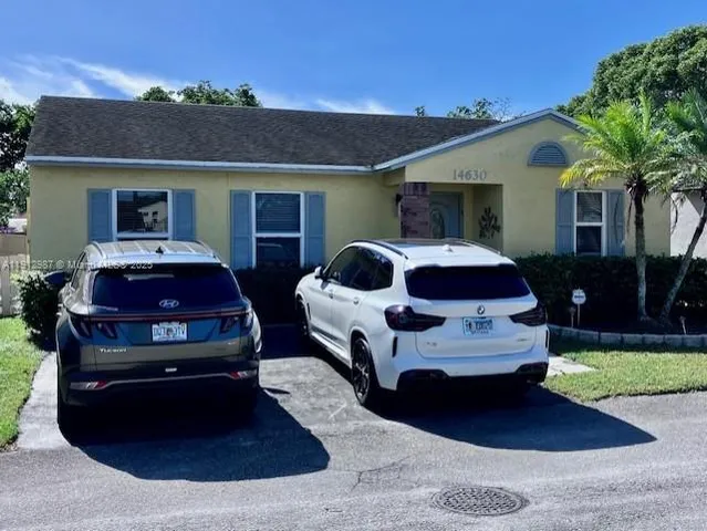 a car parked in front of a house