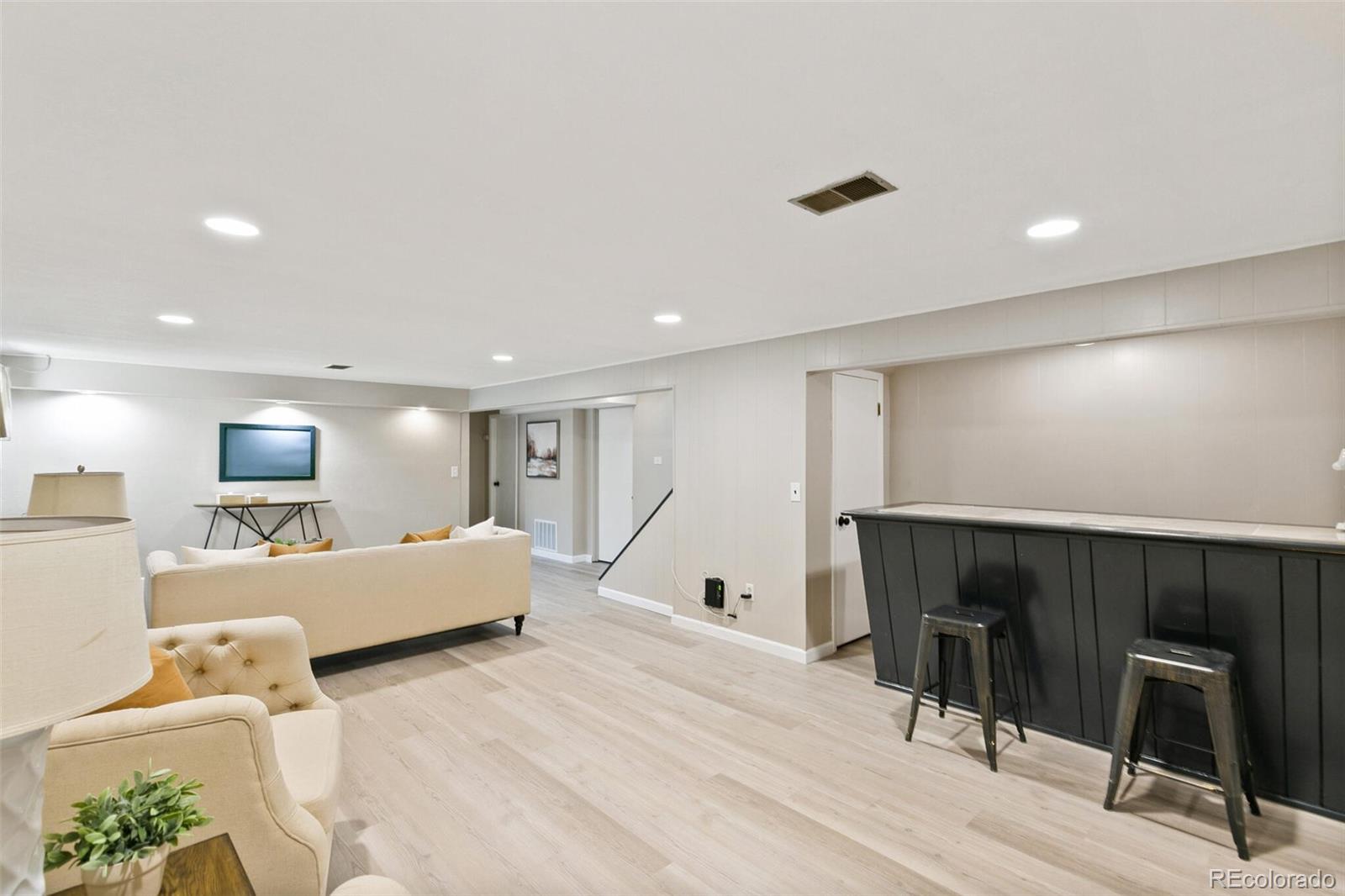 5500 Vale Drive Denver, CO 80246 - Photo 24 of 40 a bed room with a bed furniture and a night stand