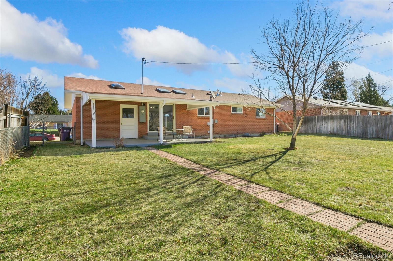 5500 Vale Drive Denver, CO 80246 - Photo 32 of 40 a view of a house with yard and tree s