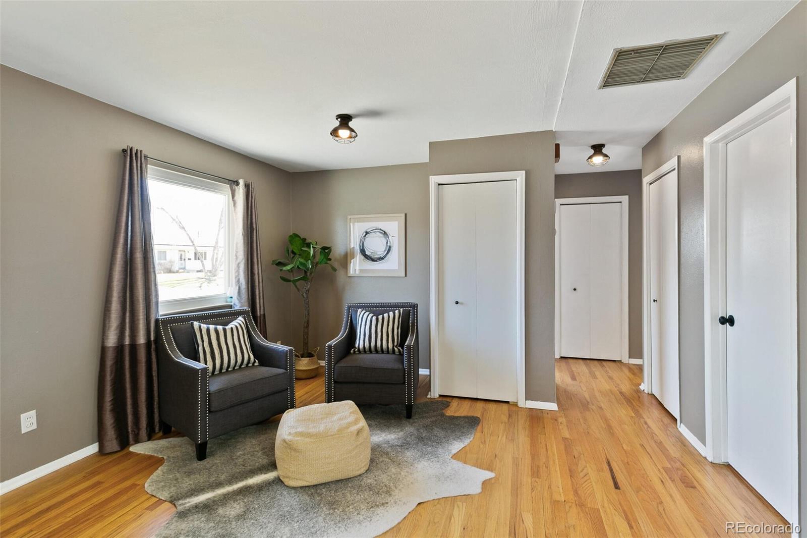 5500 Vale Drive Denver, CO 80246 - Photo 7 of 40 a living room with furniture and a window