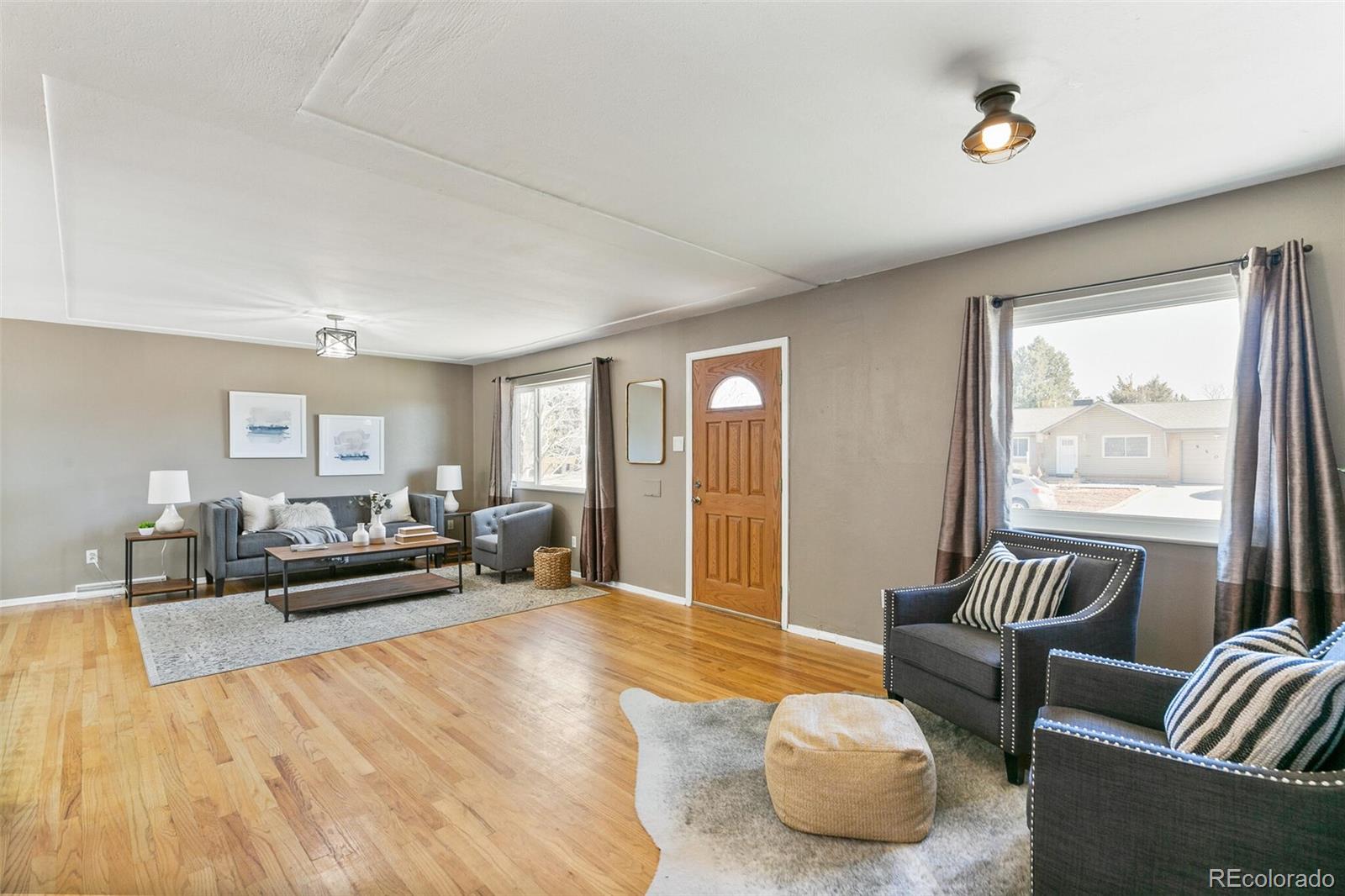 5500 Vale Drive Denver, CO 80246 - Photo 8 of 40 a living room with furniture and a large window