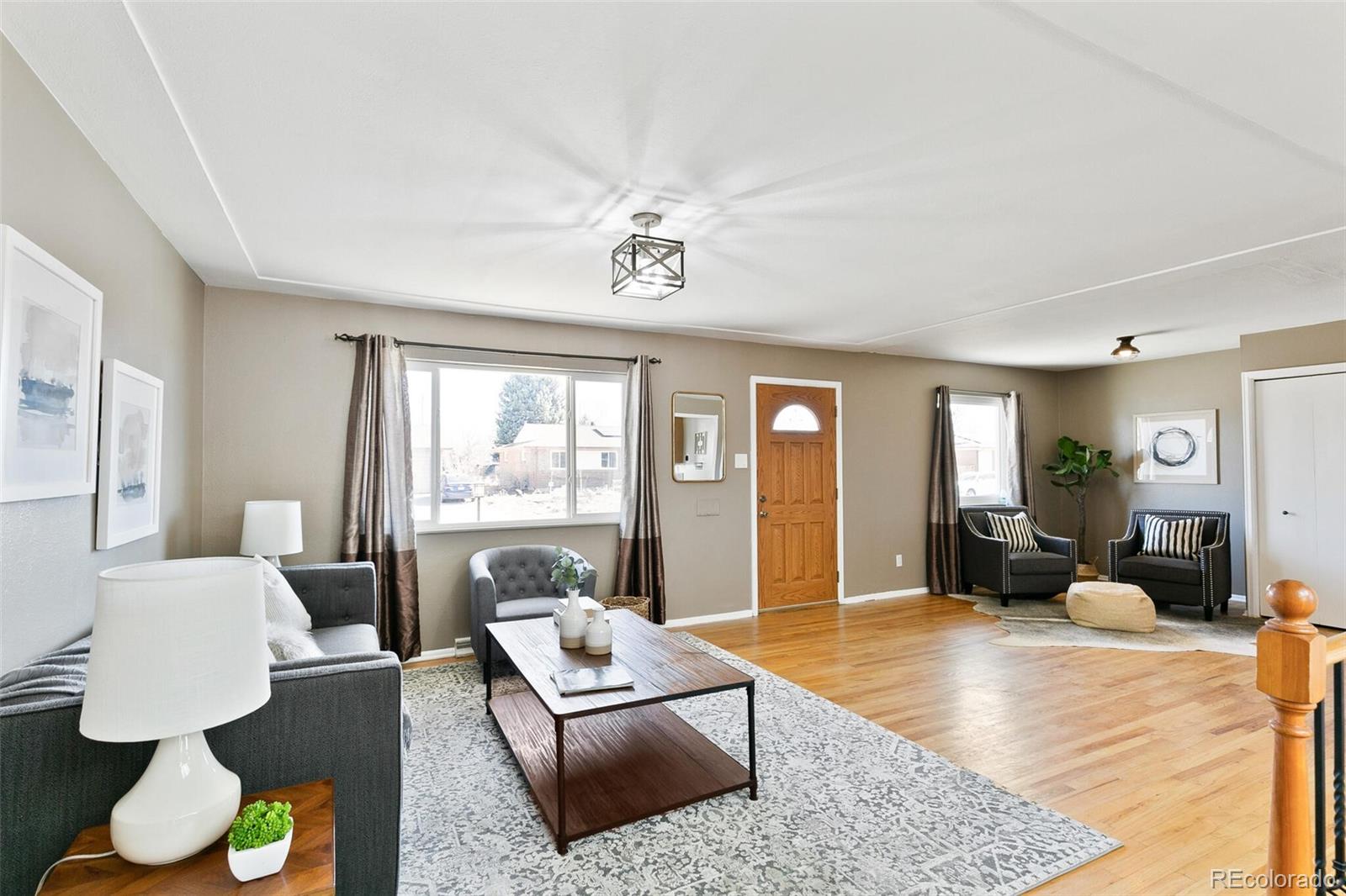 5500 Vale Drive Denver, CO 80246 - Photo 10 of 40 a living room with furniture and a large window