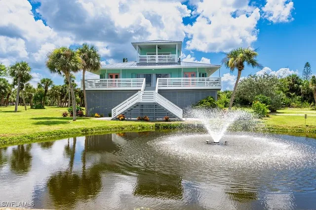 a swimming pool with outdoor seating and yard