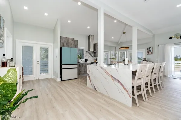 a kitchen with stainless steel appliances a refrigerator and a sink