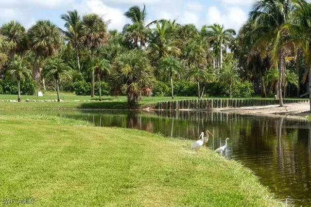 a view of a lake with a house in the background