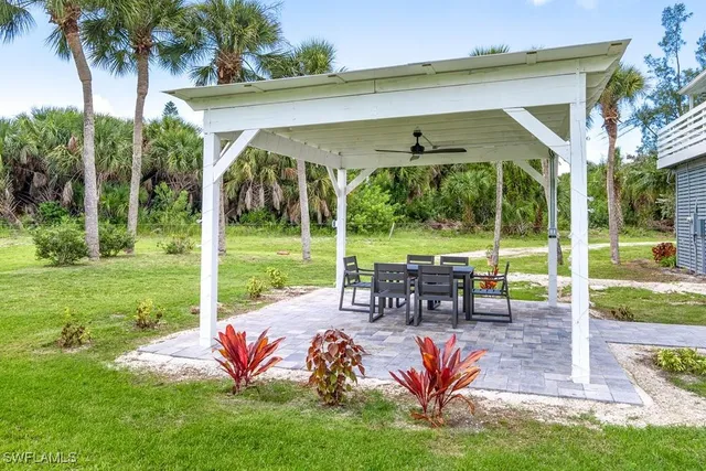 a view of a house with a yard porch and sitting area