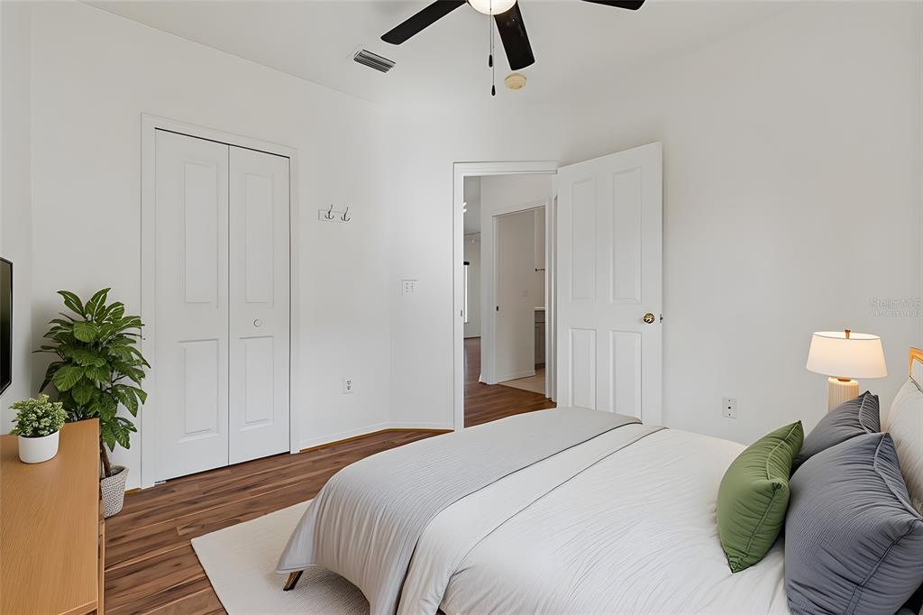 5311 Watson Road Riverview, FL 33578 - Photo 22 of 33 a bedroom with a bed and a potted plant
