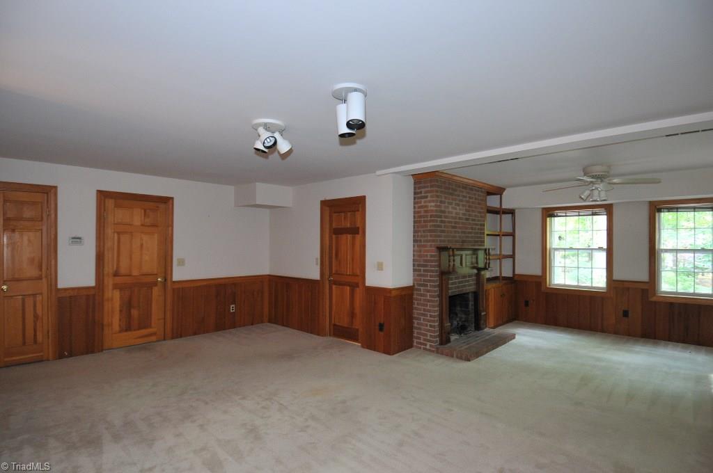 3330 Nottingham Road Winston-Salem, NC 27104 - Photo 16 of 23 Ground level playroom with fireplace