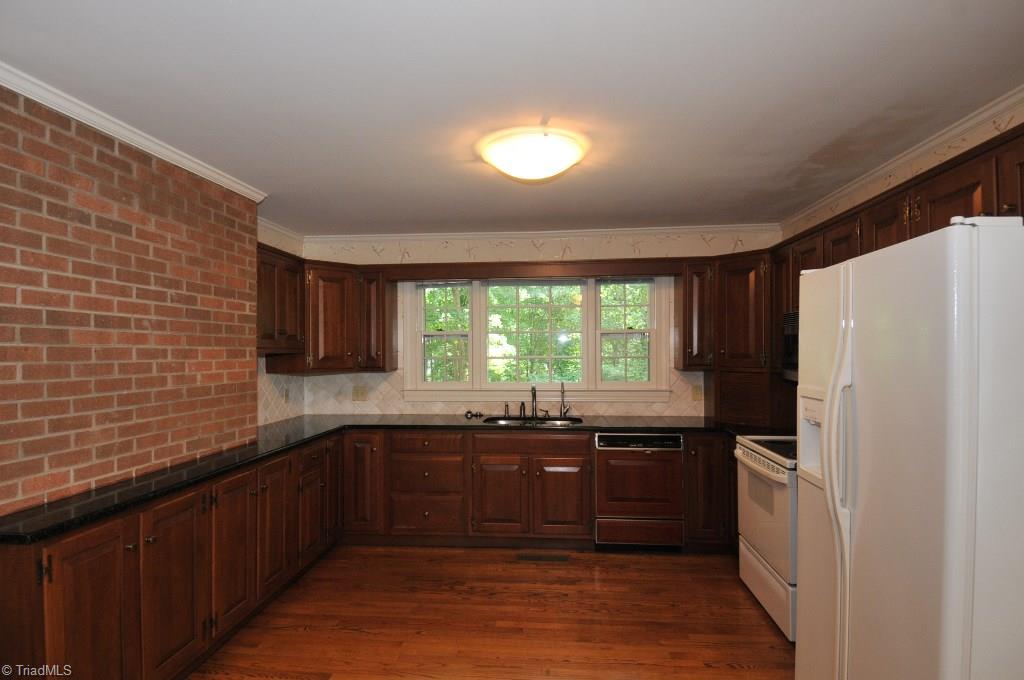 3330 Nottingham Road Winston-Salem, NC 27104 - Photo 5 of 23 Kitchen features granite countertops and cherry cabinets