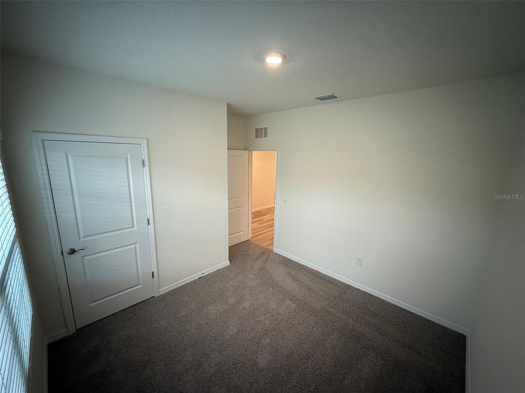 5314 Southwest 52nd Avenue Gainesville, FL 32608 - Photo 21 of 30 an empty room with an entryway
