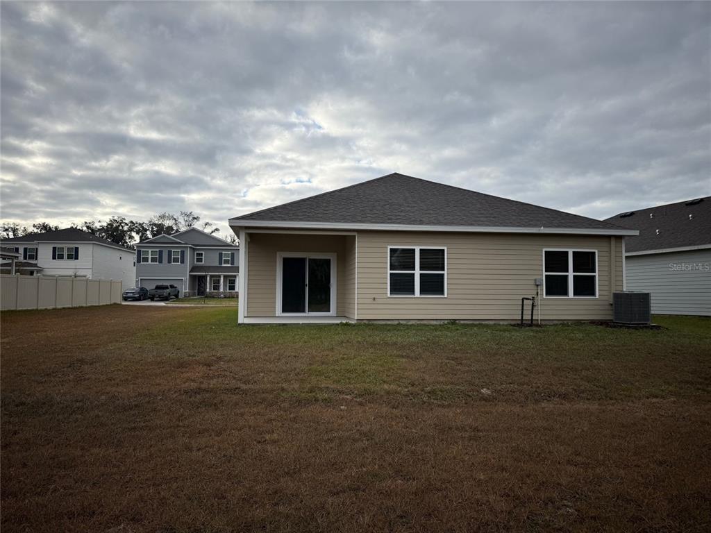 5314 Southwest 52nd Avenue Gainesville, FL 32608 - Photo 28 of 30 a front view of a house with a garden