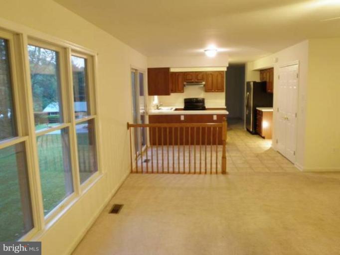6511 Upland Road Fork, MD 21051 - Photo 1 of 23 a room with a large window and furniture