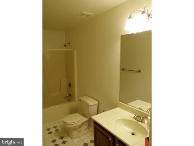 6511 Upland Road Fork, MD 21051 - Photo 15 of 23 a bathroom with a sink and a mirror