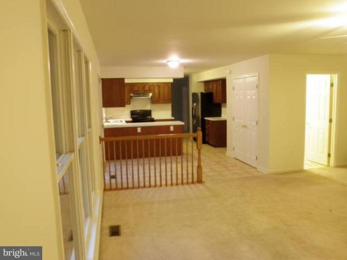 6511 Upland Road Fork, MD 21051 - Photo 4 of 23 a kitchen with stainless steel appliances a refrigerator and a stove