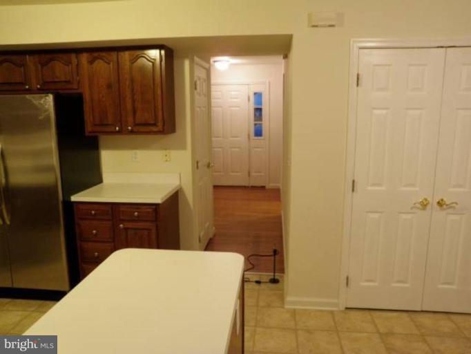 6511 Upland Road Fork, MD 21051 - Photo 5 of 23 a bedroom with a bed and a dresser