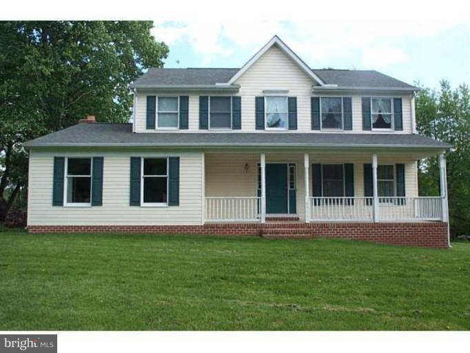 6511 Upland Road Fork, MD 21051 - Photo 6 of 23 a front view of a house with a yard