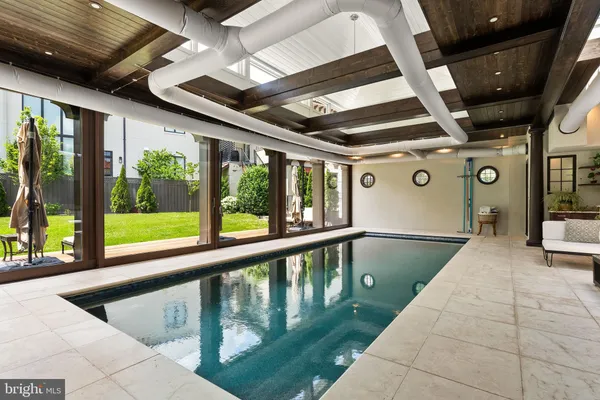 a view of swimming pool with a patio