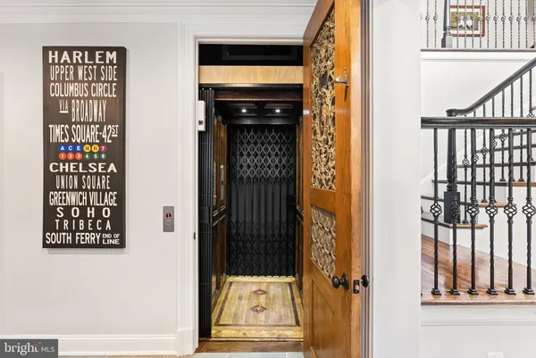 a view of a room with wooden floor windows and entryway