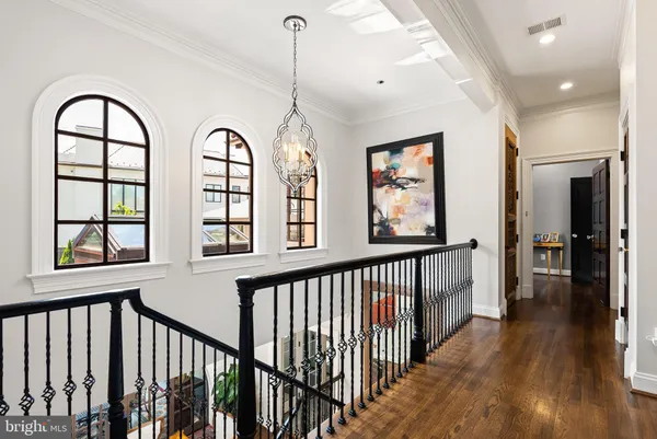 a bedroom with a bed couch and window