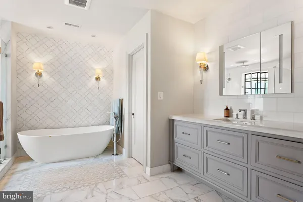 a bedroom with a bed dresser and a window