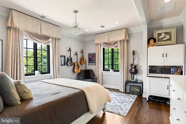 a bathroom with a granite countertop sink mirror vanity and toilet