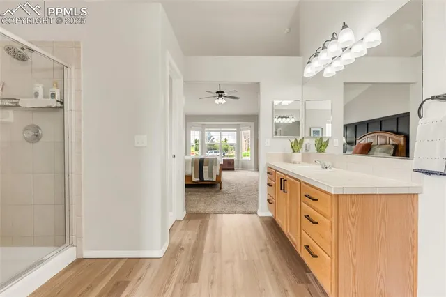 a spacious bathroom with a sink vanity and a mirror