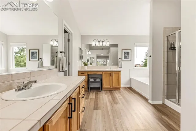 a bathroom with a sink a mirror and a bathtub